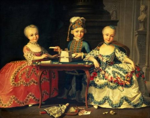 Boy In Blue Building a House of Cards, With Two Girls